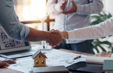 real-estate-business-team-shaking-hands-at-meeting-2026-03-20-00-36-38-utc real estate business